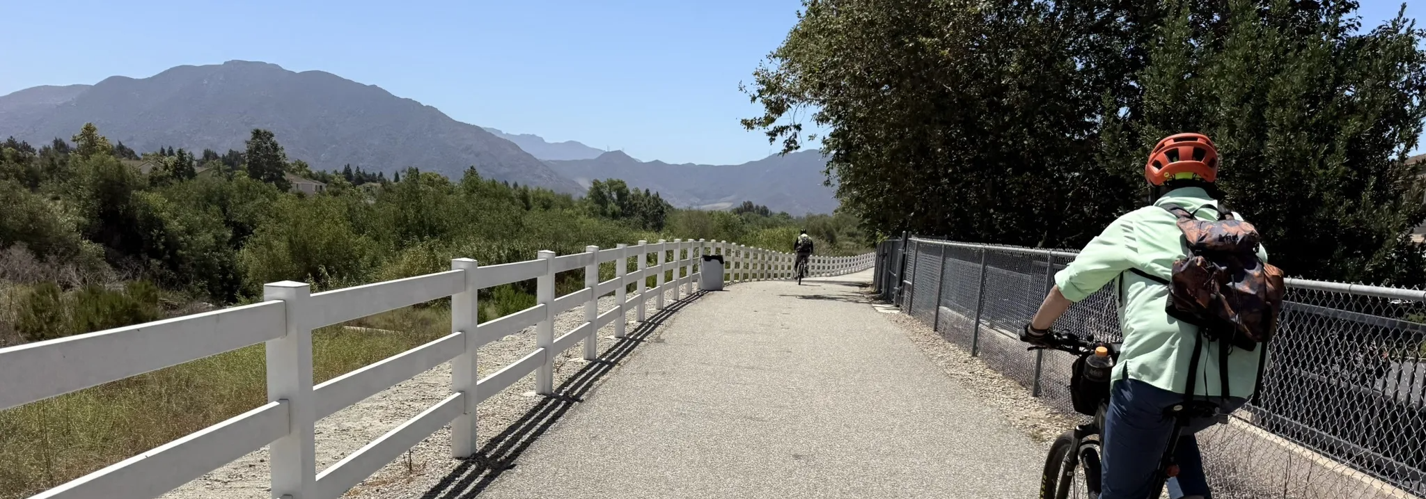 Cyclist on the Rancho Calleguas Creek Bike Path with mountain views