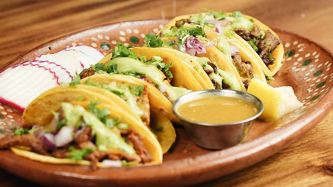 Street tacos with avocado salsa on a clay plate at Rosa Madera, Camarillo